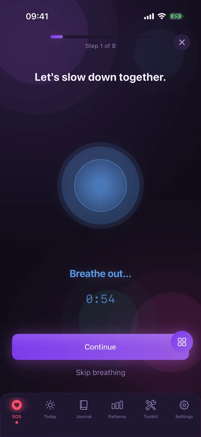 Guided breathing screen with a glowing circle and the prompt to breathe out